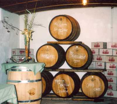 Barrels in the Opitz winery clearly marked with their contents or their ultimate destination